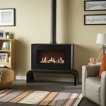 Studio-1-Freestanding-CF-with-black-front-and-matching-bench-pebble-and-stone-fuel-bed-and-black-reeded-lining-lb